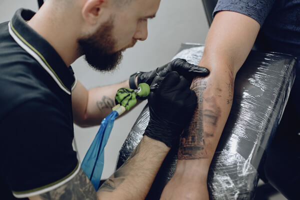Nitrile gloves in tattoo studio Tattoo artist wearing black nitrile gloves