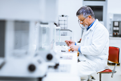 A laboratory technician uses Aqua Bidest